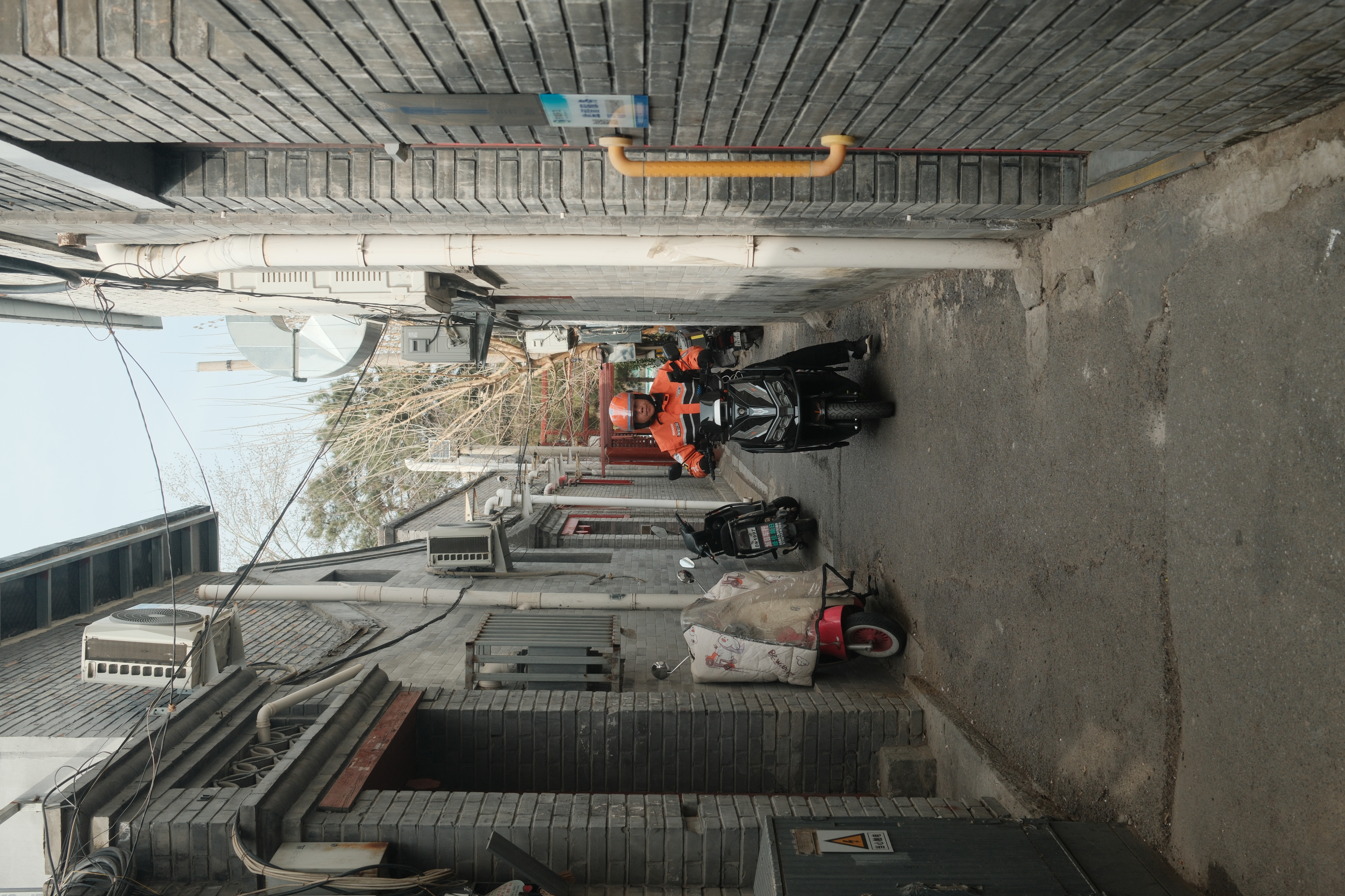 Beijing alley with worker